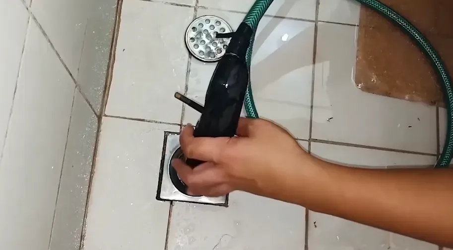 Clearing a clogged floor drain