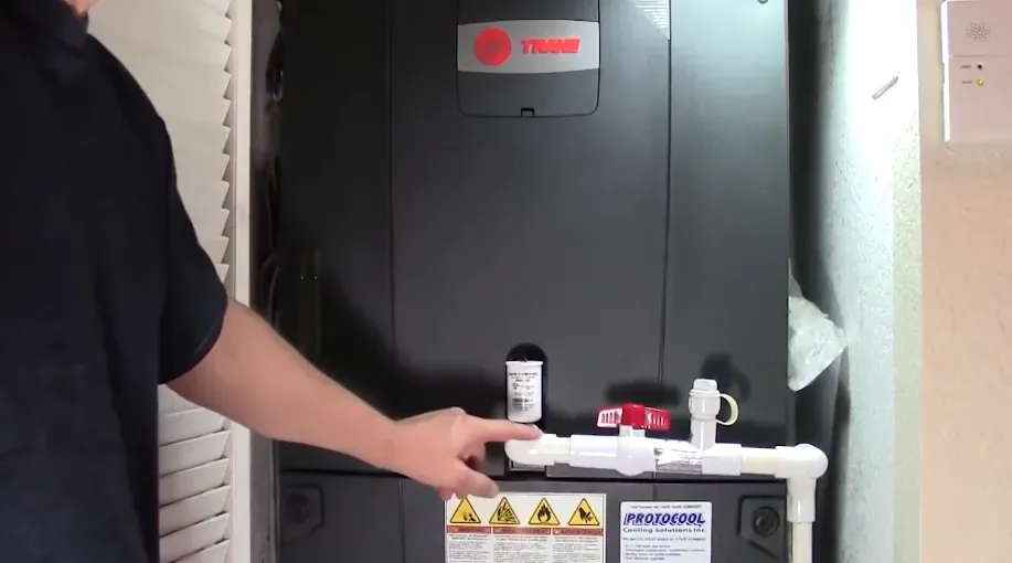 Gas furnace with its gas and vent connections in a utility closet